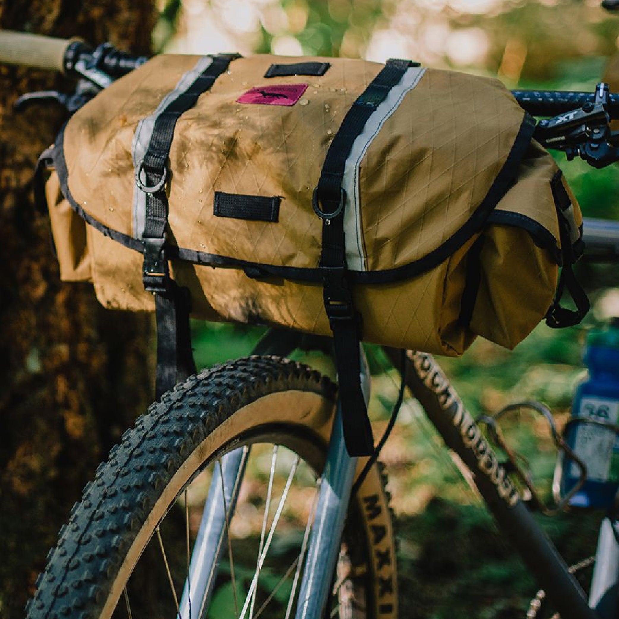 brown saddlebag attached to front of bike